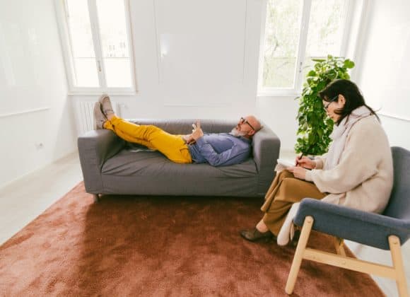“Trip free” psychedelic therapy could be coming soon man in therapy at psychologist lying on couch